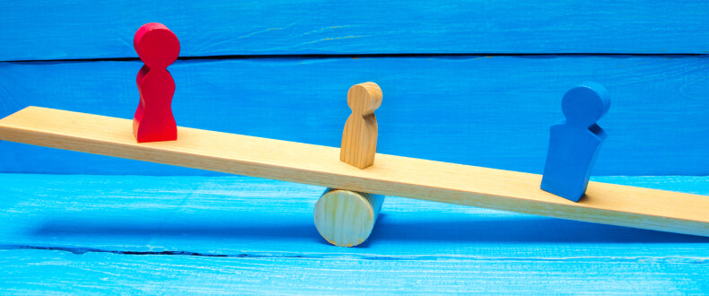 small nude block on a seesaw between a red and blue block child custody