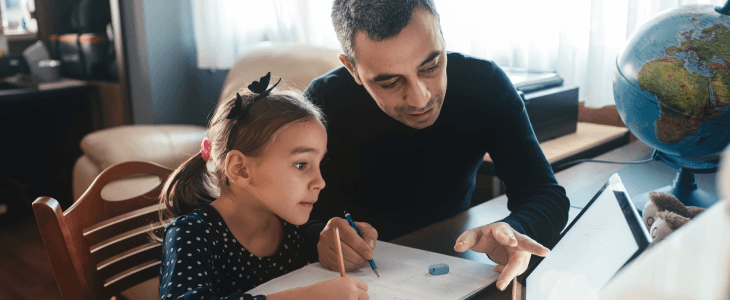 Father working with his daughter on homeschooling