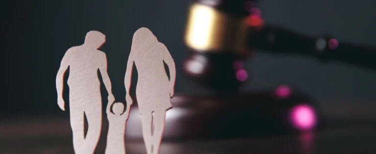Family figure and gavel on table. Family law concept