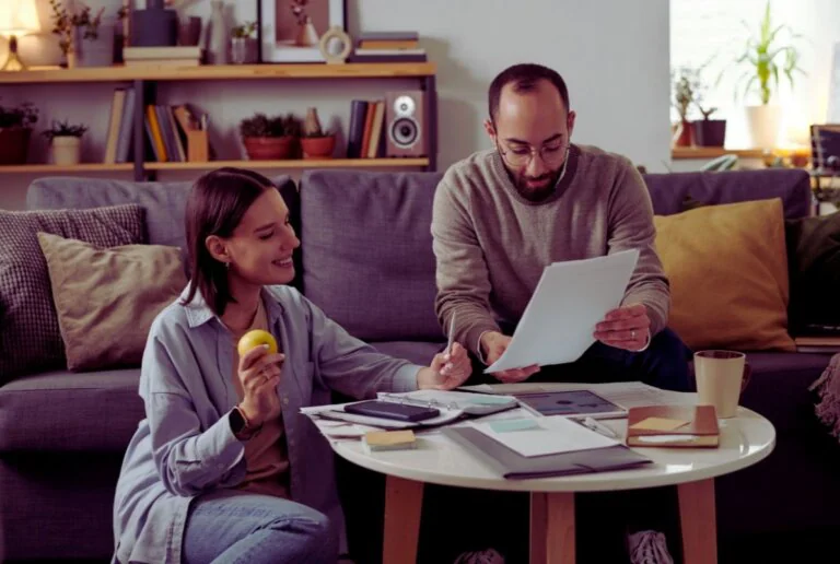 Couple reviewing documents together at home